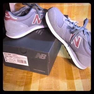 New Balance 311. Very comfy! Only worn ONE time!